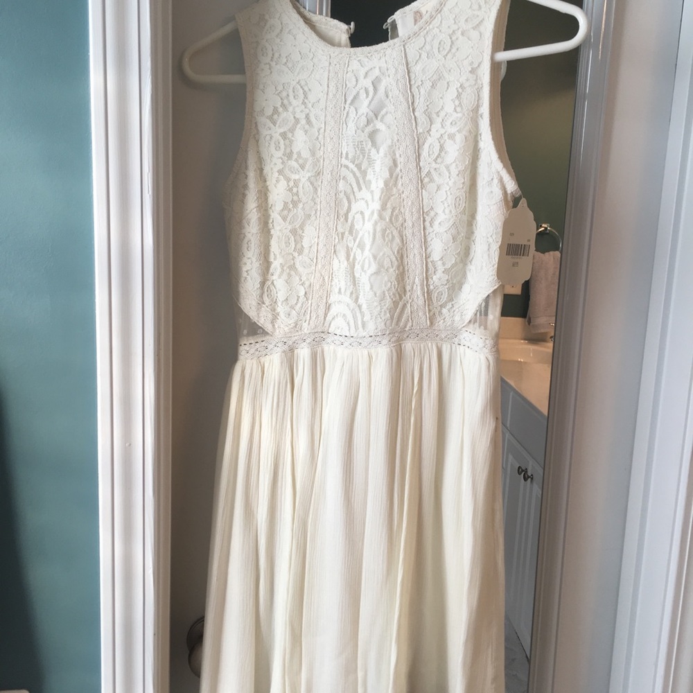 White Dress with lace cut out detail on sides!